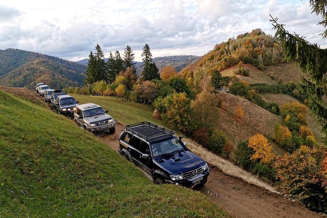 4x4 Nature Tour in Land of Dracula - 1 day - Magura, Pestera, and Piatra Craiului views between wooden houses