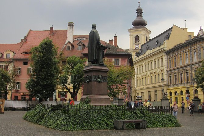 Day Trip to Sibiu and Fagaras Fortress from Bucharest - Fagaras Fortress with its moat, Michael the Brave, and The Iron Lady